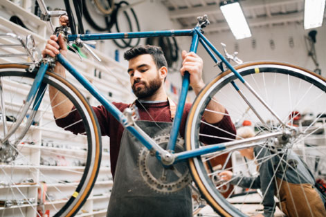 Bike shop owner working.